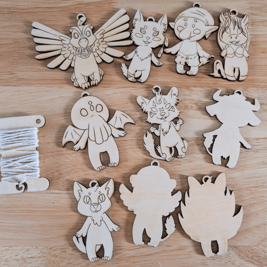 Mythical chibis DIY ornaments. Top left to bottom right thunderbird, coyote, troll, kelpie, cthulhu, dajoji, nekomata. Minotaur, spinx and kitsune are showing the blank backs. DIY Myths, Legends and Monster Chibi Set: Coyote, Cthulhu, Da - jo - ji, Kelpie, Kitsune, Minotaur, Nekomata, Spinx, Thunderbird and Troll Art & Craft Kits Raven King Crafts