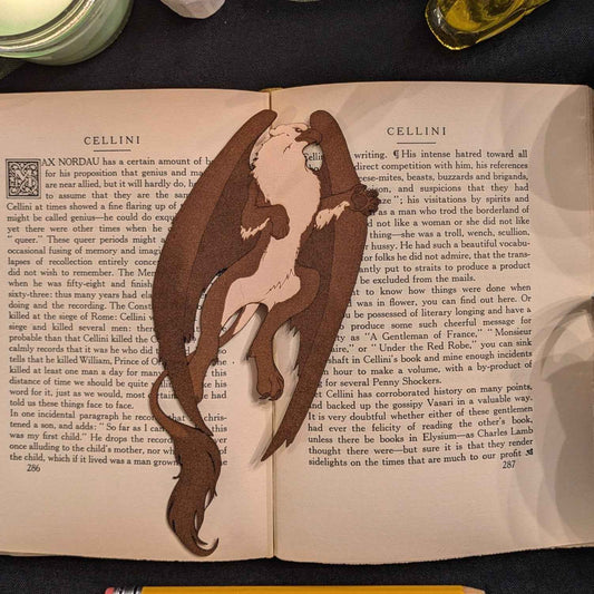 A leather bookmark shaped like a griffin.