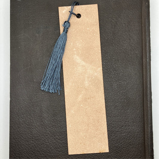 The backs of the leather bookmarks are unfinished and you can see the leather grain.