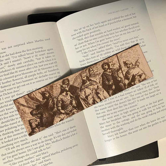 A leather bookmark engraved with the antique art of King Arthur and his knights.