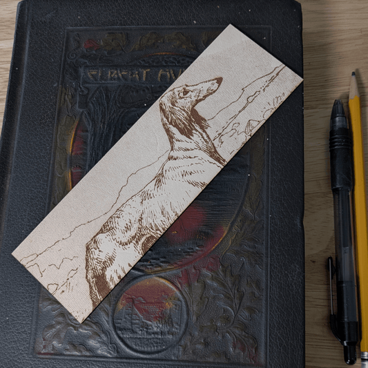 A rectangular leather bookmark with the historical art of an Afghan Greyhound dog engraved on it. Leather Afghan Greyhound Bookmark Bookmarks Raven King Crafts Leather Afghan Greyhound Bookmark Bookmarks Raven King Crafts