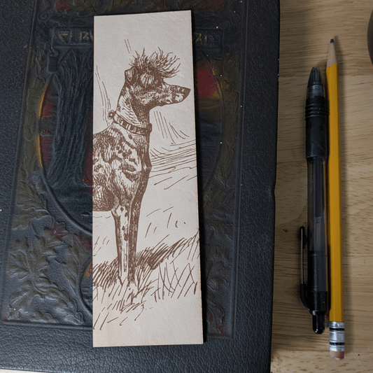 A rectangular leather bookmark with the historical art of a Chinese Crested dog engraved on it. Leather Chinese Crested Dog Bookmark Bookmarks Raven King Crafts