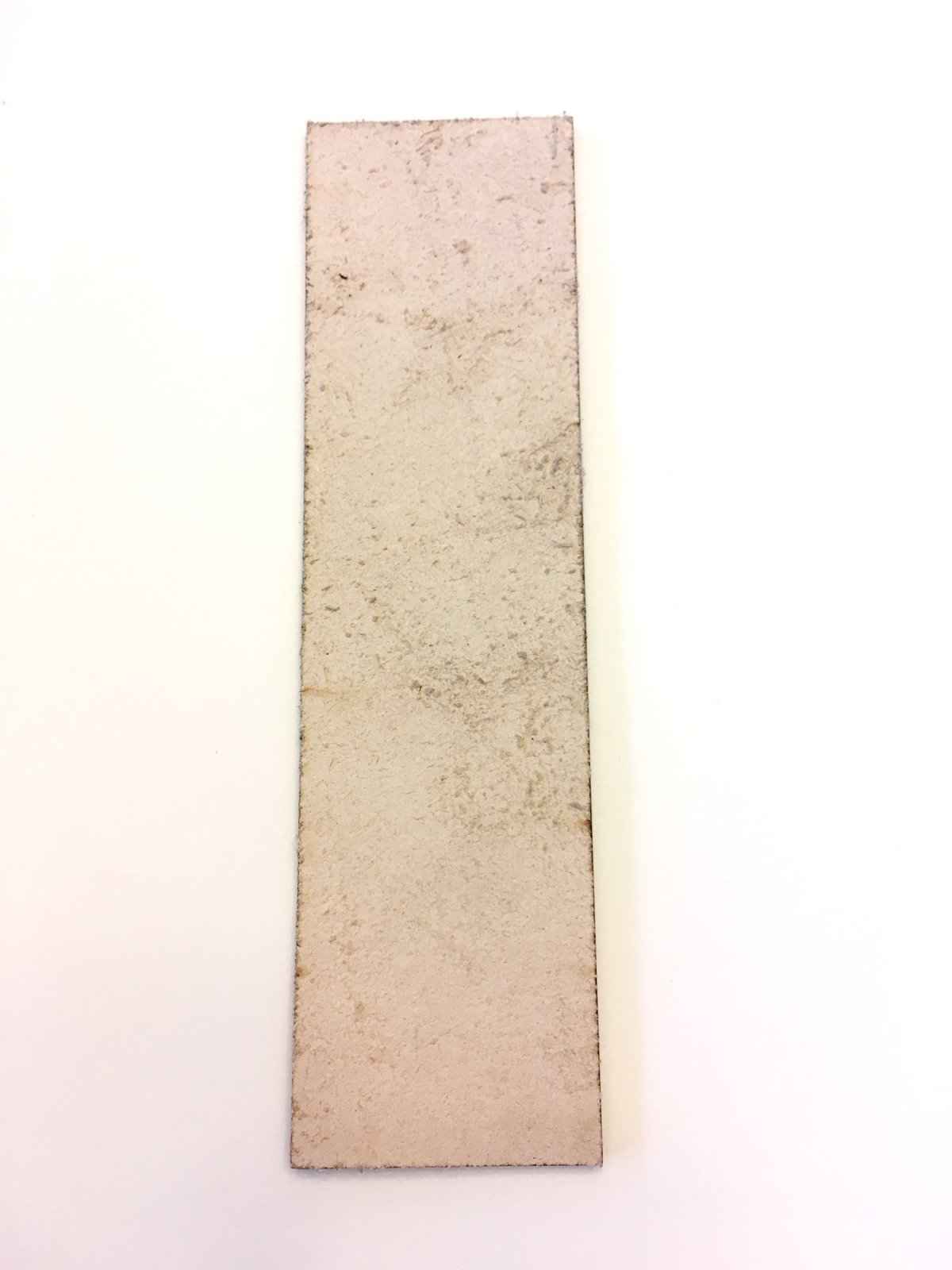 The backs of the leather bookmarks are unfinished and you can see the leather grain.