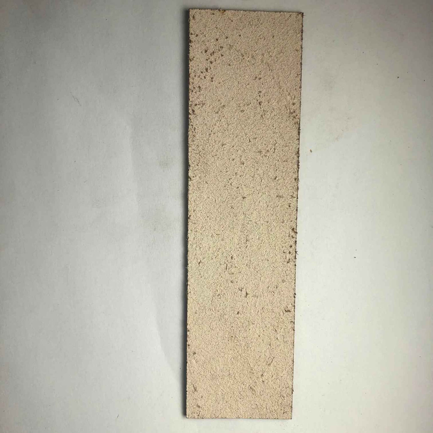 The backs of the leather bookmarks are unfinished and you can see the leather grain.