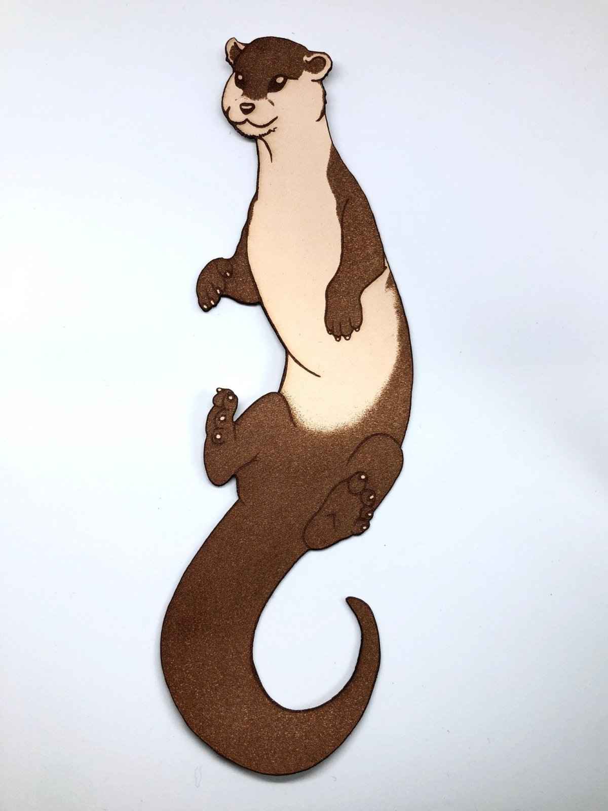 This adorable leather bookmark shaped like an otter.