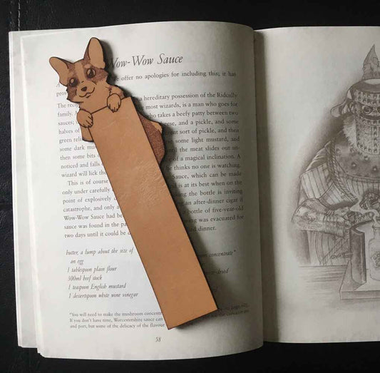 A cute leather bookmark with a Pembroke Welsh Corgi dog at the top of it. It has a blank area you can personalize with a name or short message.