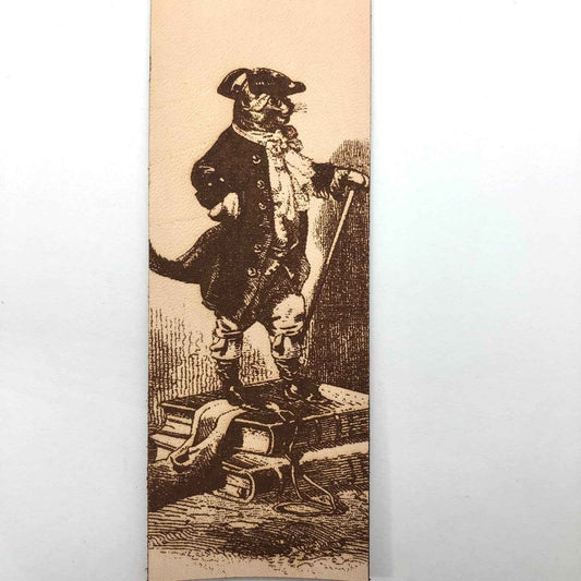 A leather bookmark with the antique art of Puss in Boots Bookmark on it.