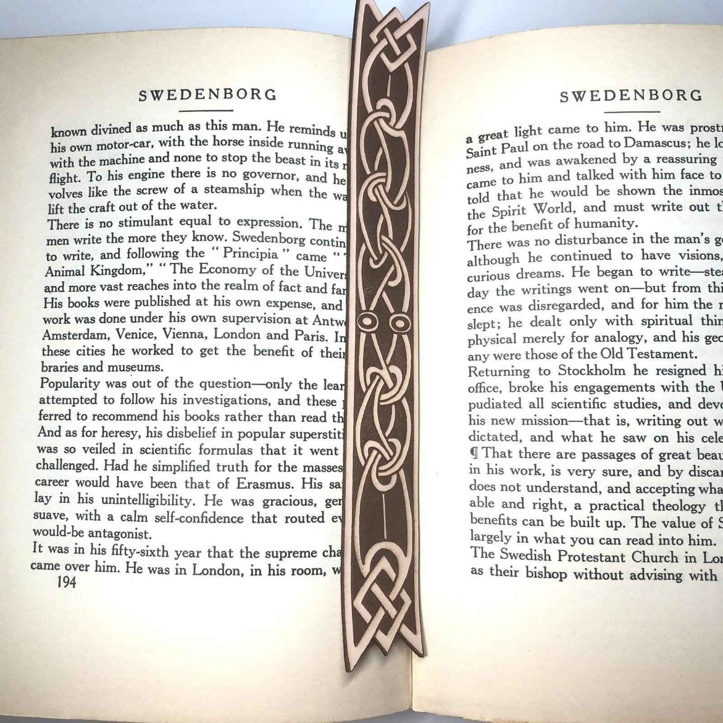 A leather bookmark with the antique art of Celtic ribbon on it.