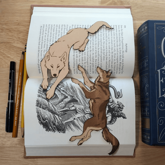 This photograph shows both wolf bookmarks available. Running Wolf Bookmark Bookmarks Raven King Crafts