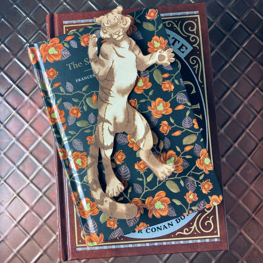 A leather bookmark shaped like a tiger.