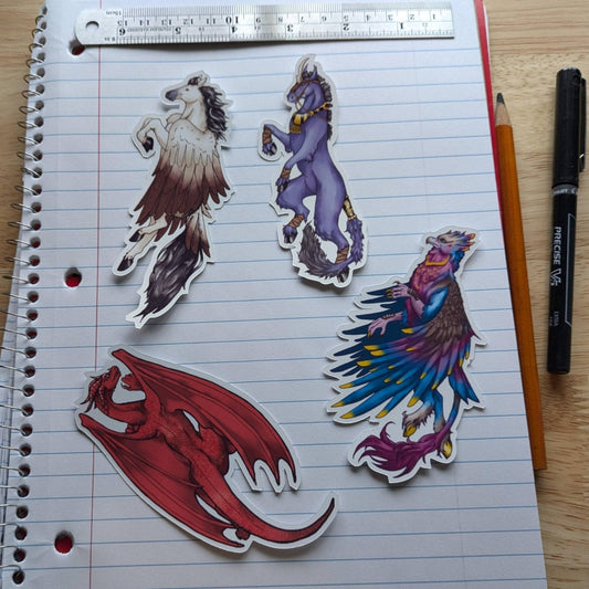 The mythical beasts sticker pack: top left is pegasus, dark unicorn, red dragon and tropical hippogriff. Vinyl Sticker Packs - Pick Your Stickers! stickers Raven King Crafts Vinyl Sticker Packs - Pick Your Stickers! stickers Raven King Crafts