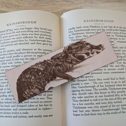 A leather bookmark engraved with the art of a West African Crocodile on it.