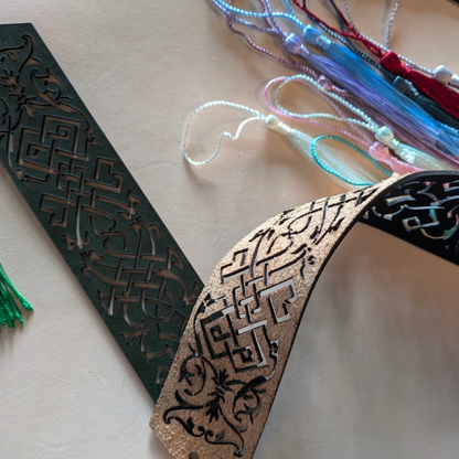 The backs of the leather bookmarks are unfinished but the scroll decal is cut through it.