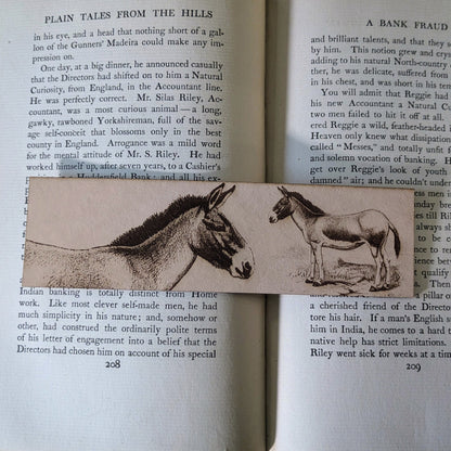 A leather bookmark with the art of a Tibetan wild donkey on it.