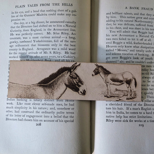 A leather bookmark with the art of a Tibetan wild donkey on it.