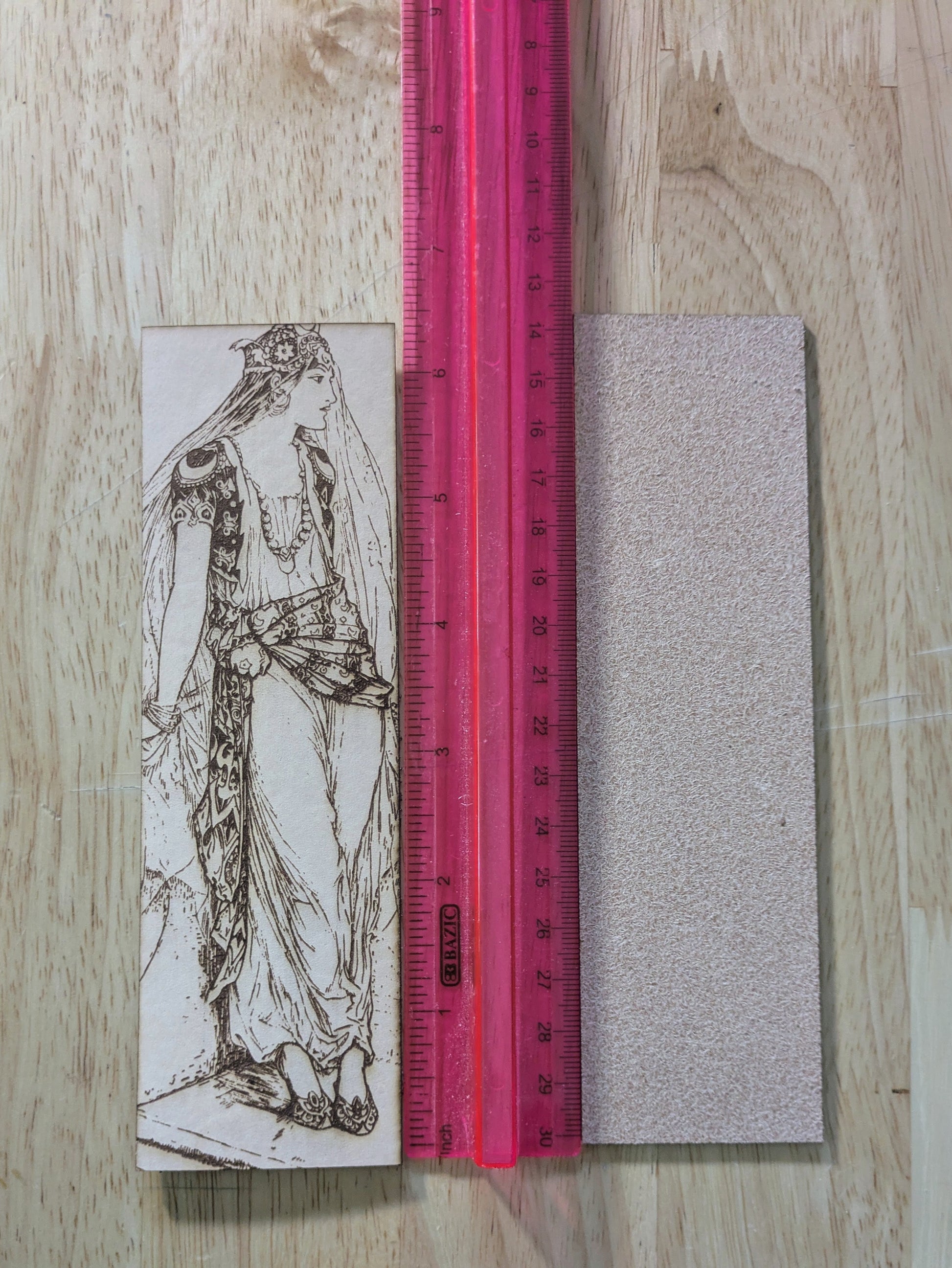 Leather bookmark with the antique art of a fairy tale princess engraved on it. 