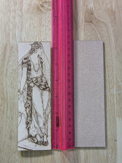 Leather bookmark with the antique art of a fairy tale princess engraved on it. 