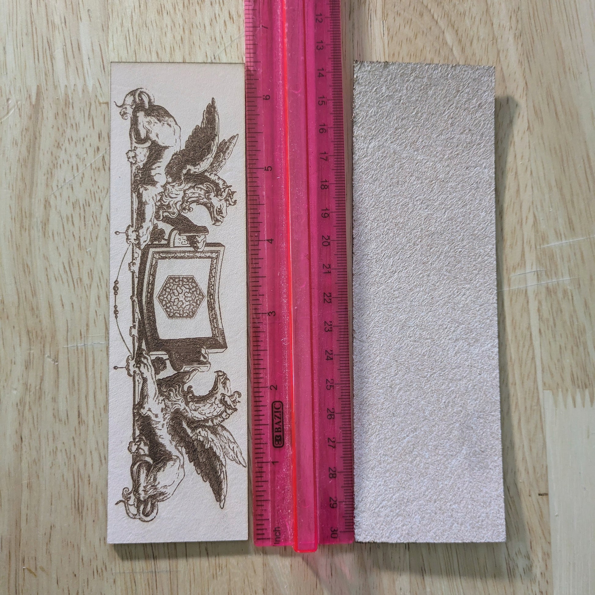 Leather griffin bookmark by the ruler