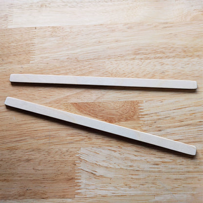 The photograph is a pair of wooden spreader sticks that come with the loom kit.