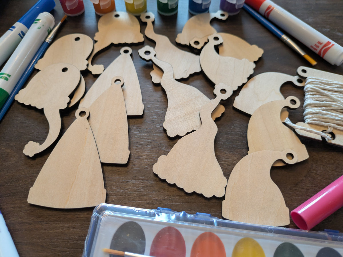 A photograph of wooden Santa Christmas ornament blanks. 