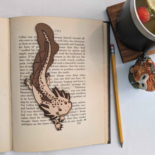 A leather bookmark shaped like an axolotl salamander. Adorable Axolotl Salamander Leather Bookmark Bookmarks Raven King Crafts
