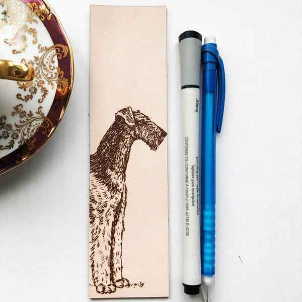 The leather bookmark with the antique art of an airedale terrier dog engraved on it. Airedale Terrier Leather Bookmark - Dog Collection Bookmarks Raven King Crafts