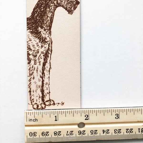 Airedale Terrier Bookmark next to a ruler for scale. Airedale Terrier Leather Bookmark - Dog Collection Bookmarks Raven King Crafts