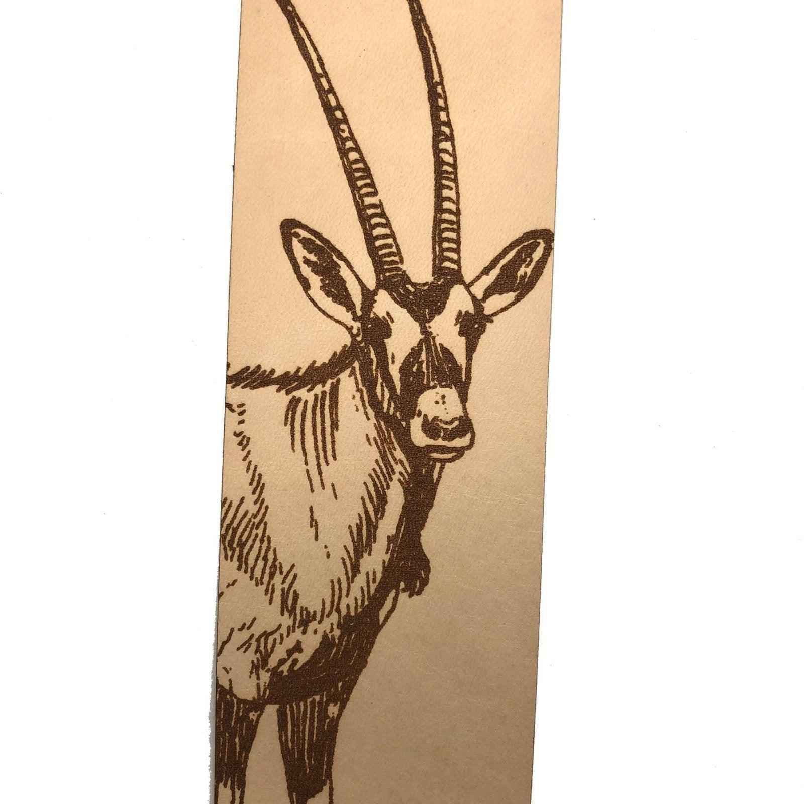 A leather bookmark engraved with the art of an antelope on it. Antelope Leather Bookmark Bookmarks Raven King Crafts