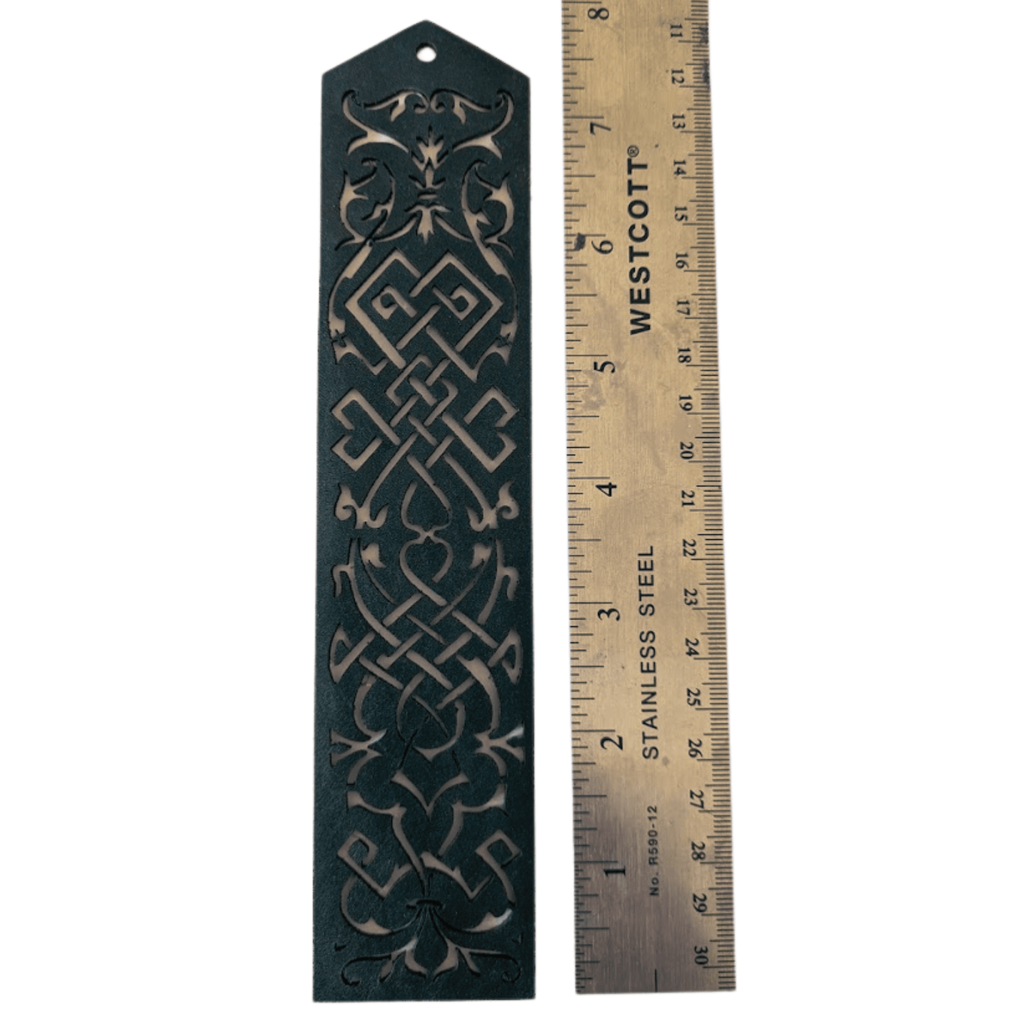 The blue leather cutout bookmark next to a ruler to show scale. Blue Cutout Leather Bookmark with Tassel Hole Bookmarks Raven King Crafts