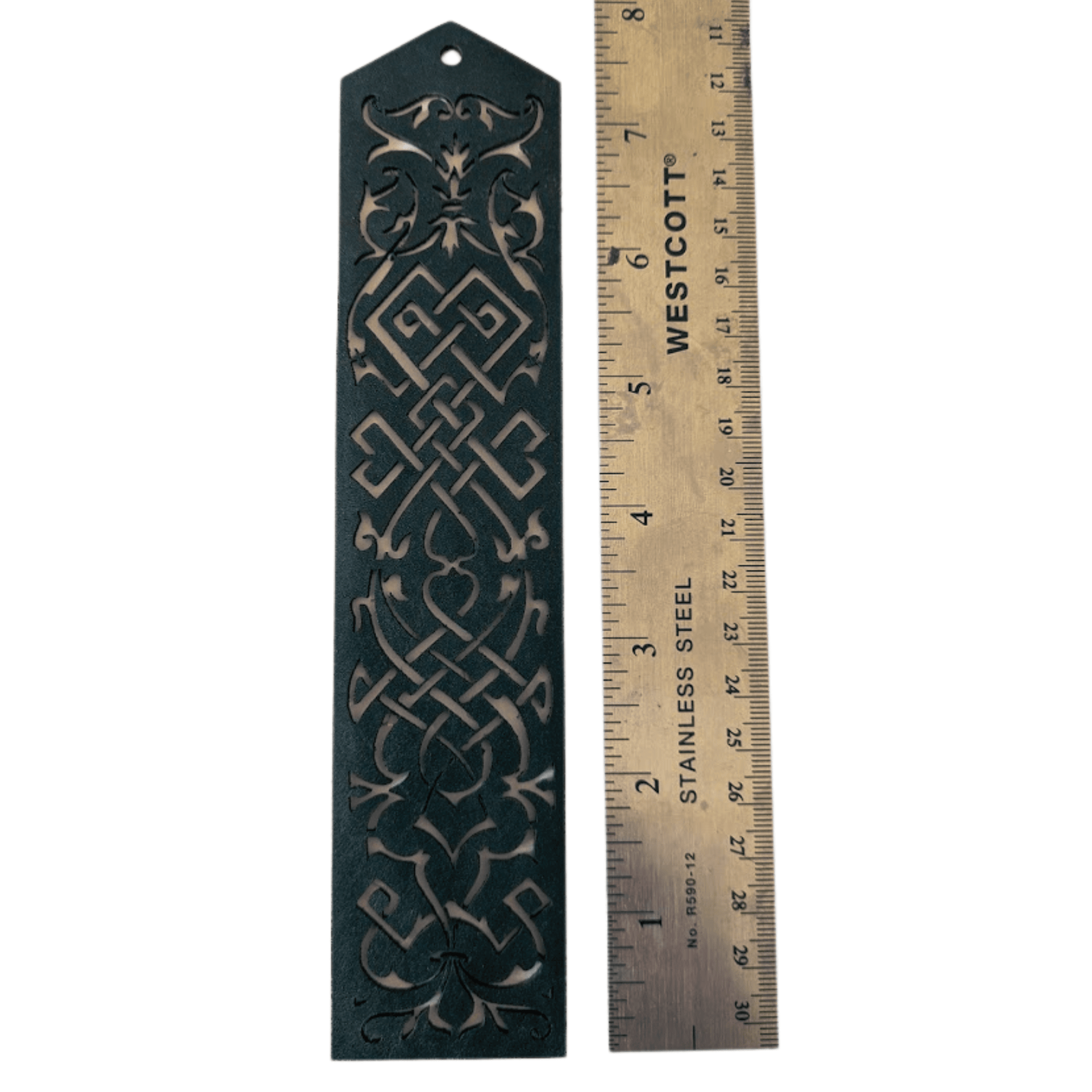 The blue leather cutout bookmark next to a ruler to show scale. Blue Cutout Leather Bookmark with Tassel Hole Bookmarks Raven King Crafts