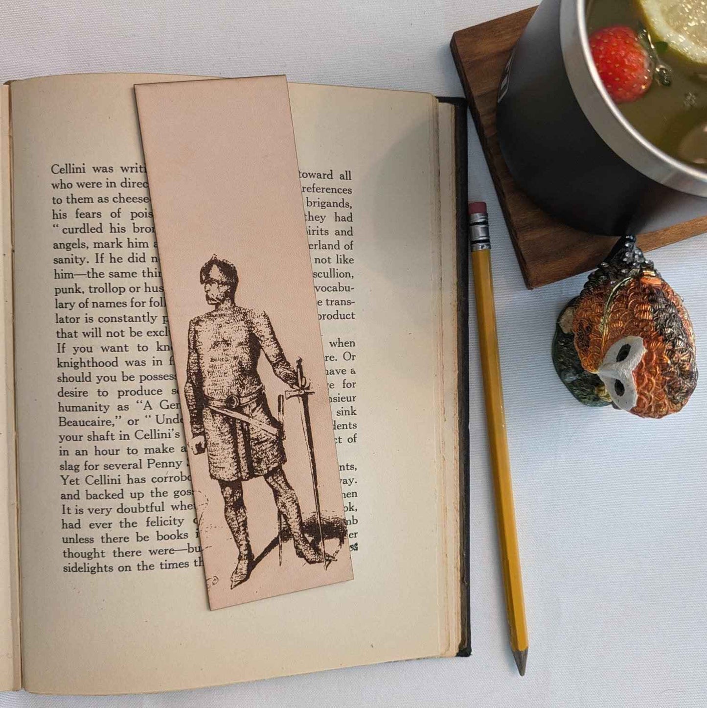 A leather bookmark with the antique art of a knight wearing chain mail on it. Chain Mail Knight with a Sword - Historical Leather Bookmark Bookmarks Raven King Crafts