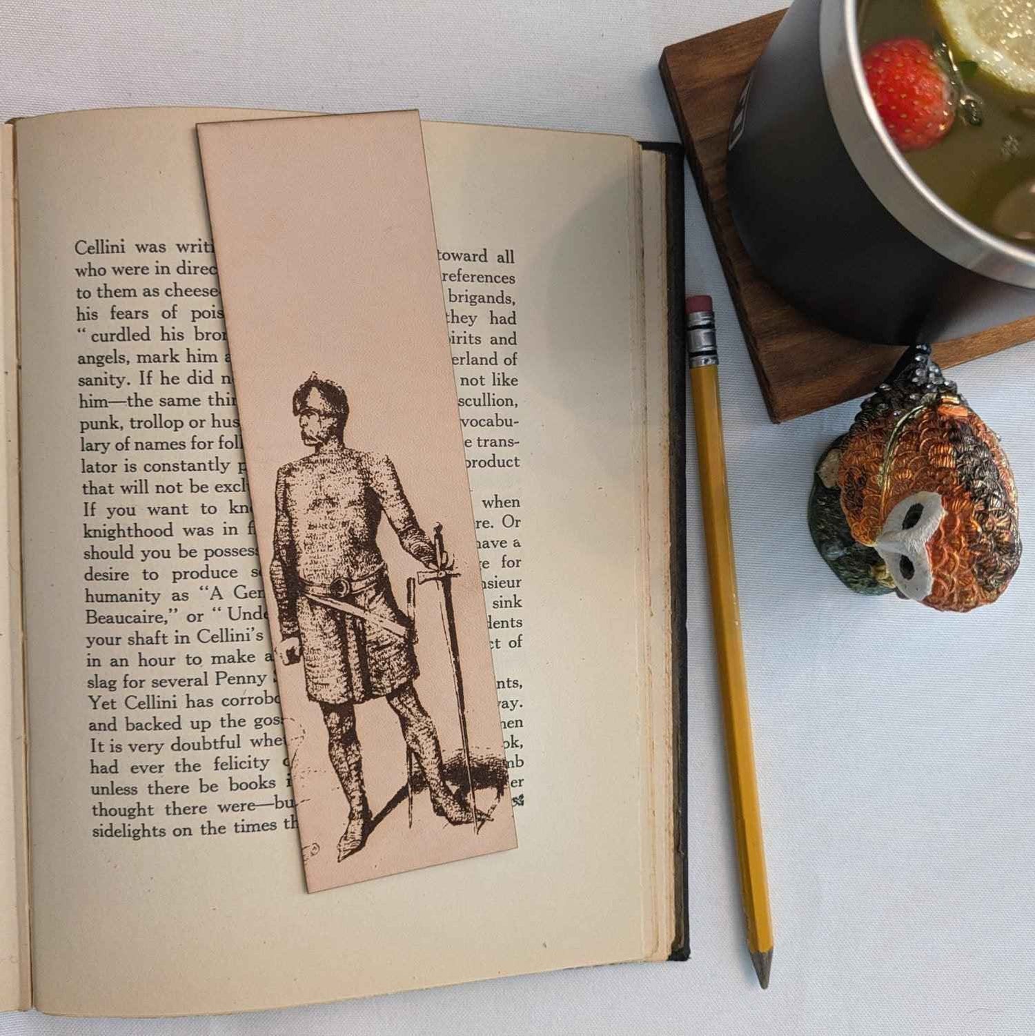 A leather bookmark with the antique art of a knight wearing chain mail on it. Chain Mail Knight with a Sword - Historical Leather Bookmark Bookmarks Raven King Crafts