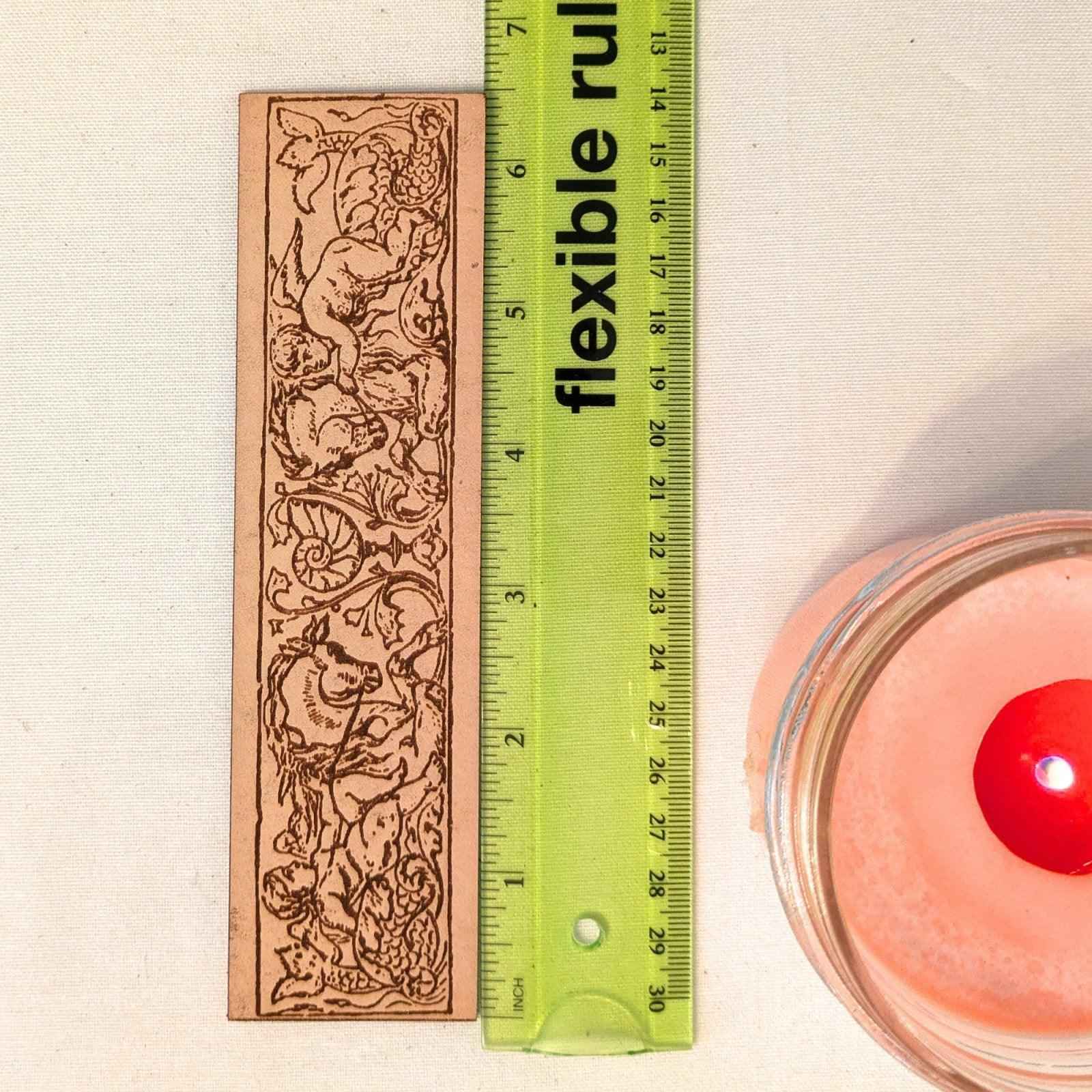 Cherubs Riding Hippocampus Bookmark - Leather Cherubs Riding Hippocampus Bookmark - Leather Bookmarks Raven King Crafts