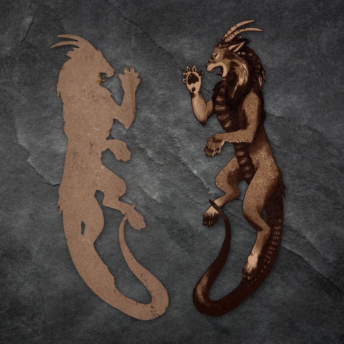 The left of the image shows the back of the bookmark as being unengraved with the natural grain of the leather visible. The right one is the engraved bookmark. Chimera Bookmark - Leather Bookmarks Raven King Crafts