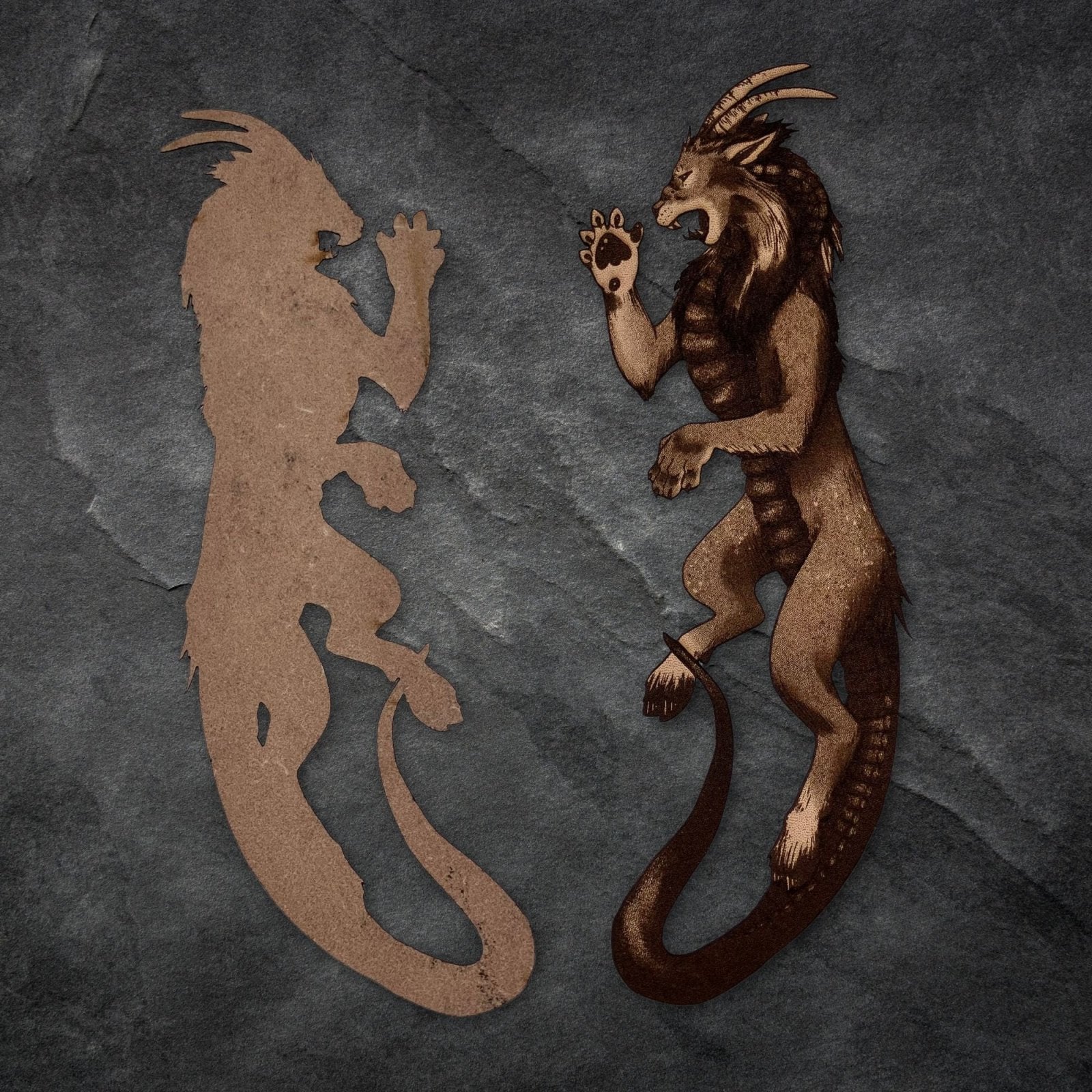 The left of the image shows the back of the bookmark as being unengraved with the natural grain of the leather visible. The right one is the engraved bookmark. Chimera Bookmark - Leather Bookmarks Raven King Crafts