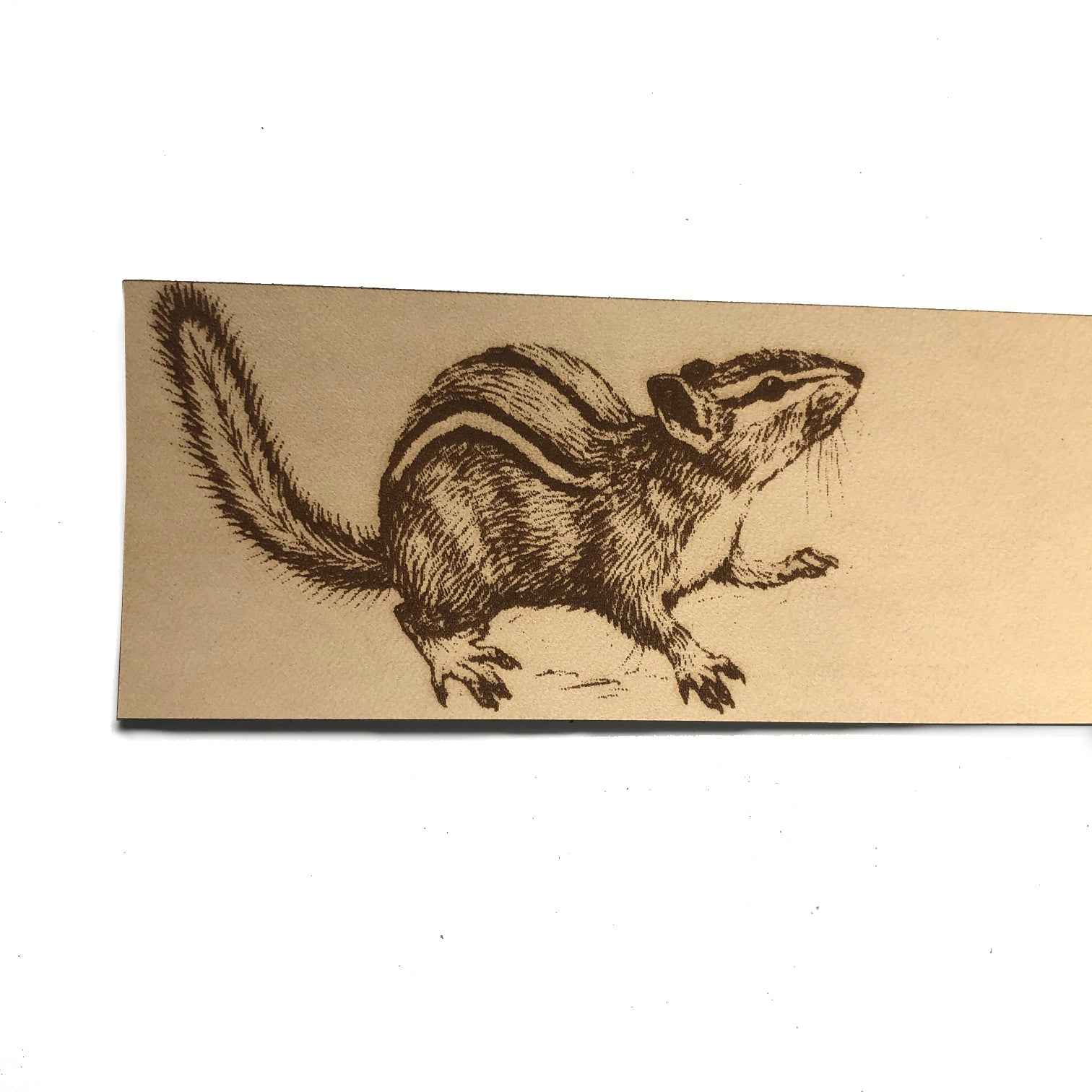 A leather bookmark engraved with the antique art of a chipmunk on it. Chipmunk Bookmark Bookmarks Raven King Crafts