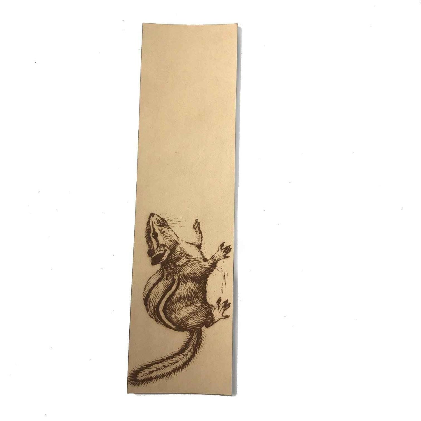 A leather bookmark engraved with the antique art of a chipmunk on it. Chipmunk Bookmark Bookmarks Raven King Crafts