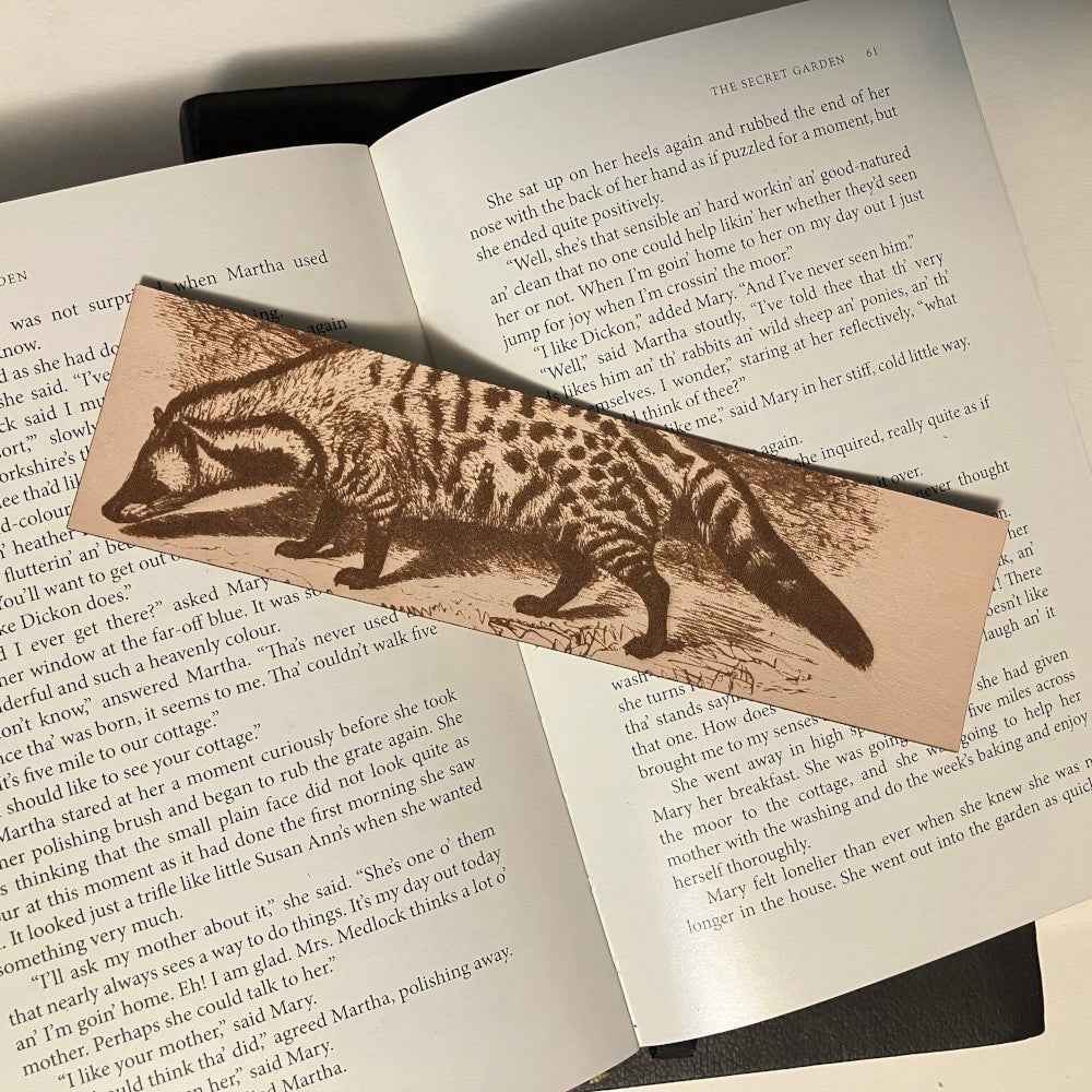 A leather bookmark engraved with the antique art of a civet on it. Civet Bookmark - Leather Bookmarks Raven King Crafts