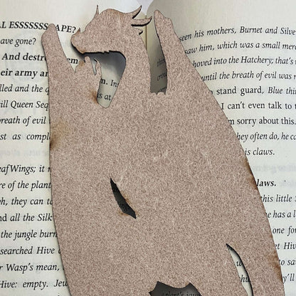 This photo shows the back of the leather dragon bookmark. There is no design on the back. Climbing Dragon Bookmark Bookmarks Raven King Crafts