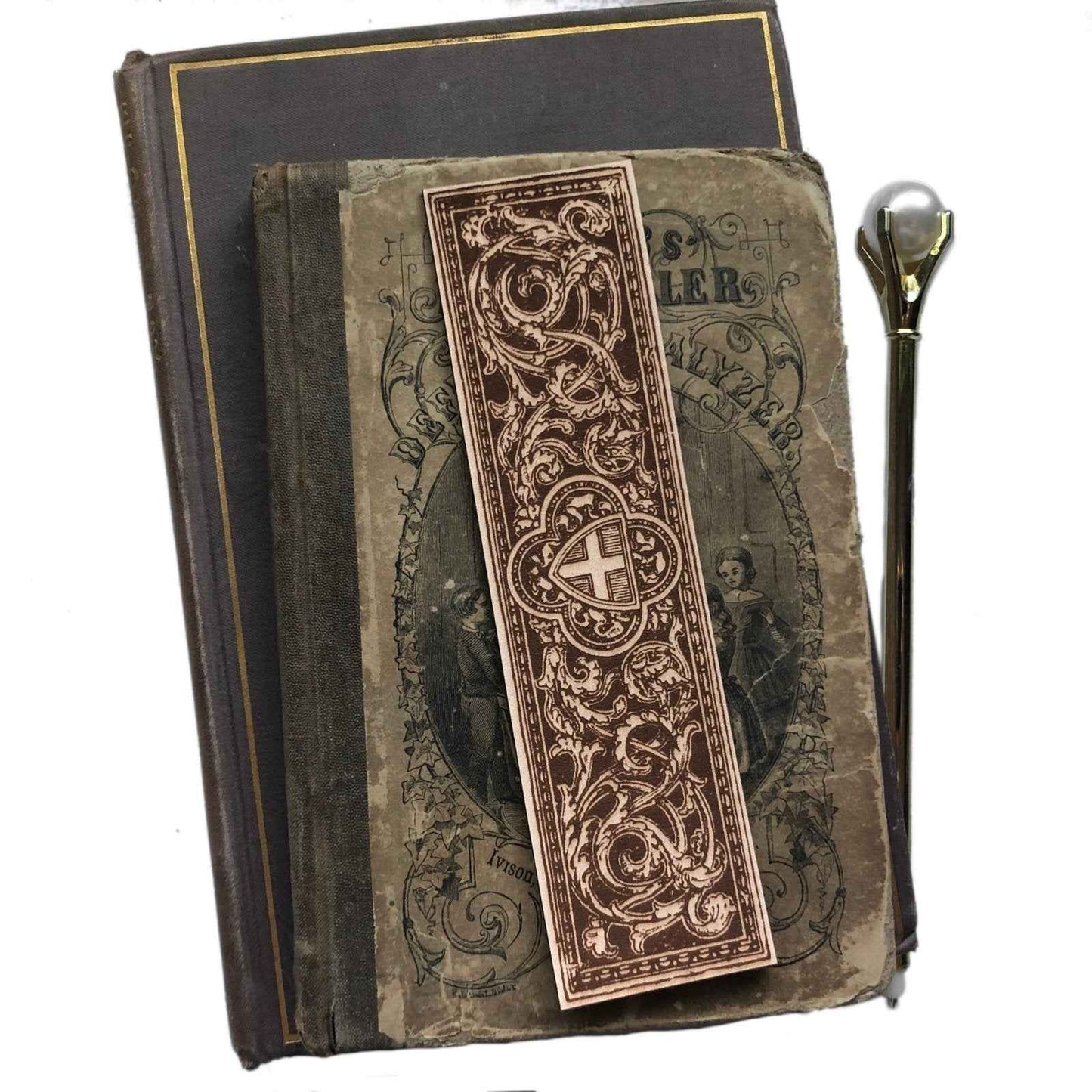 A leather bookmark engraved with the antique art of a cross and shield. Cross and Shield Leather Bookmark Bookmarks Raven King Crafts