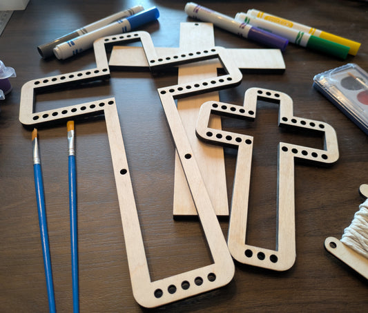 A angled photo of the wooden cross looms. Cross Loom Kit Art & Craft Kits Raven King Crafts