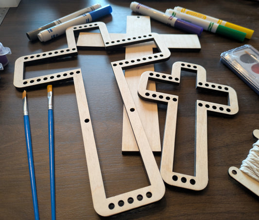 A angled photo of the wooden cross looms.