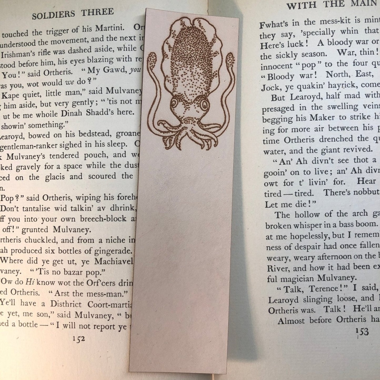 A cuttlefish engraved onto a leather bookmark.