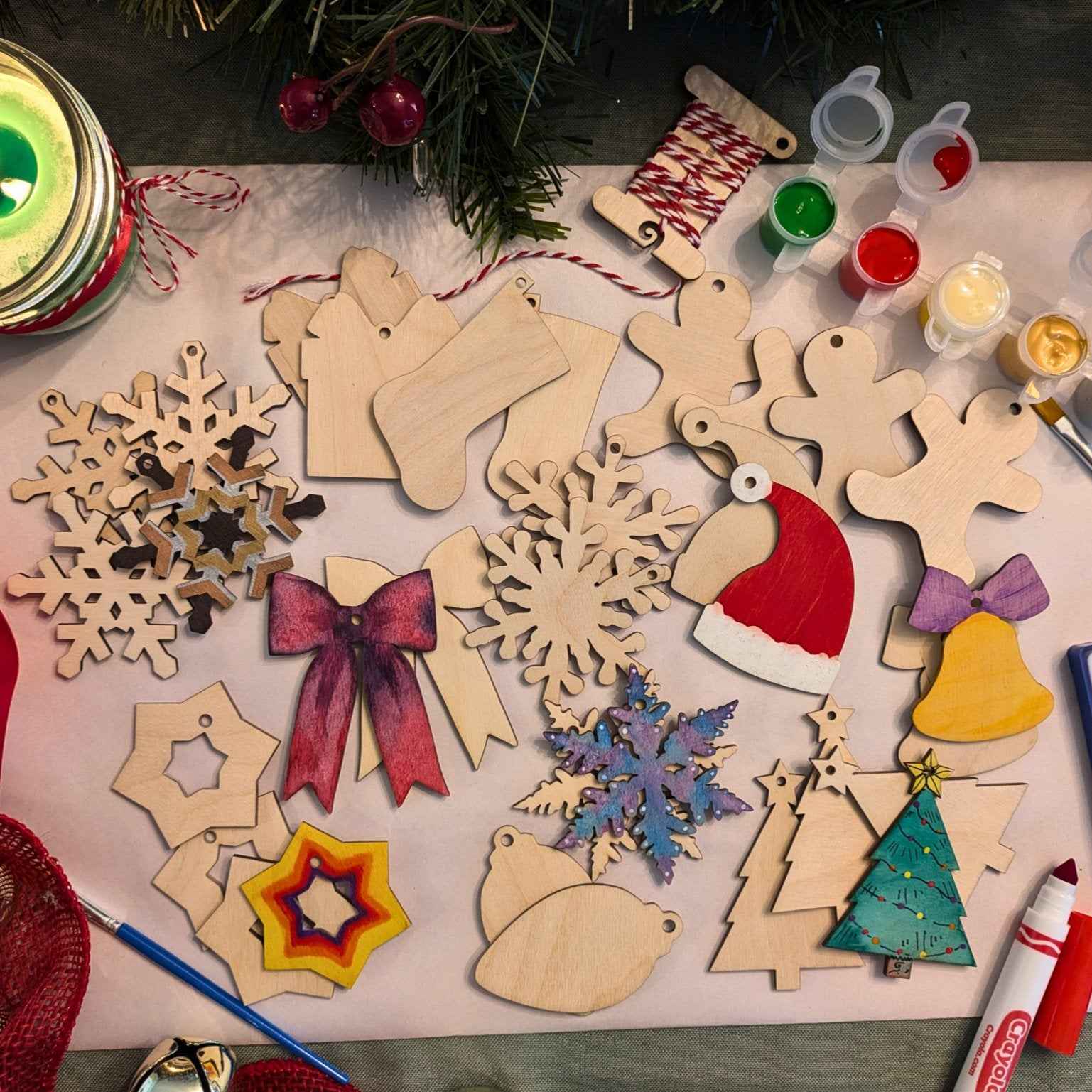 A photograph of our wooden Christmas ornament kit, with some of the Christmas shaped ornaments decorated as examples. DIY Wooden Christmas Ornament Kits for Creative Holiday Crafting Art & Crafting Materials Raven King Crafts