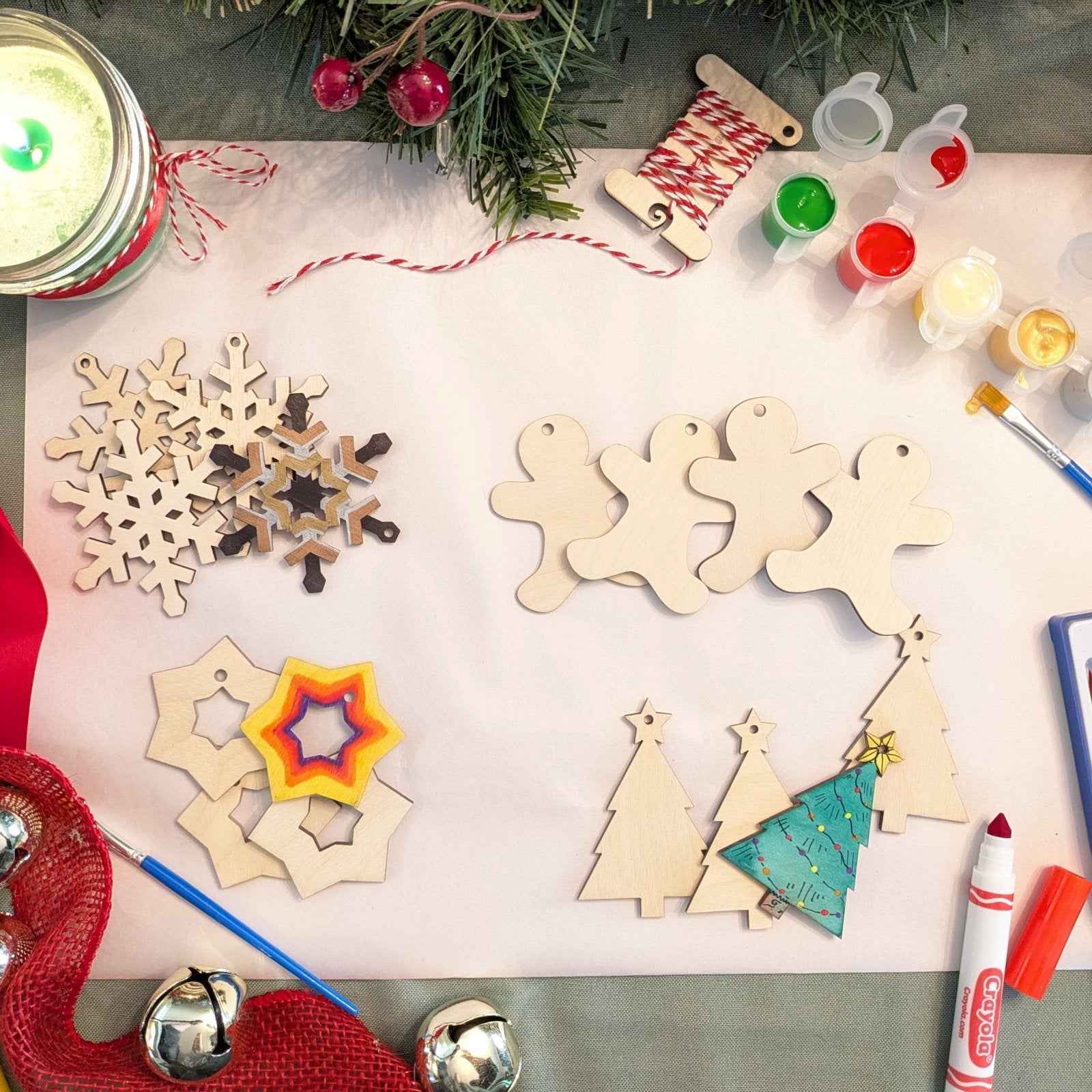 A photograph of our wooden Christmas ornament kit, with some of the Christmas shaped ornaments decorated as examples. DIY Wooden Christmas Ornament Kits for Creative Holiday Crafting Art & Crafting Materials Raven King Crafts