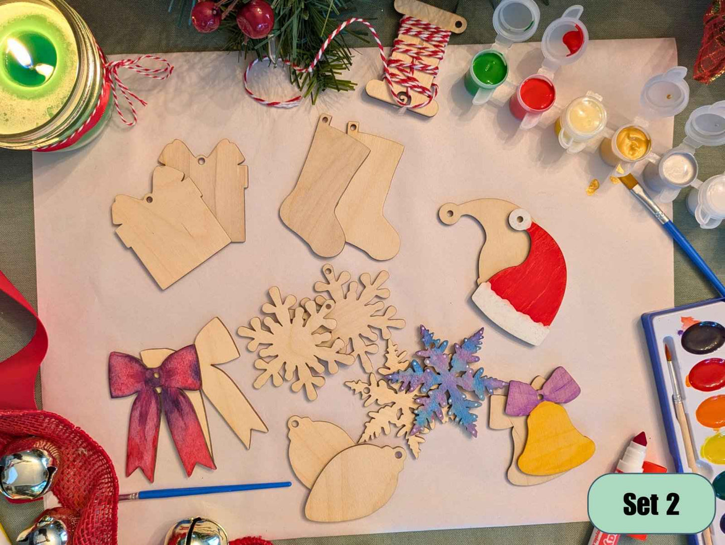 A photograph of our wooden Christmas ornament kit, with some of the Christmas shaped ornaments decorated as examples. DIY Wooden Christmas Ornament Kits for Creative Holiday Crafting Art & Crafting Materials Raven King Crafts