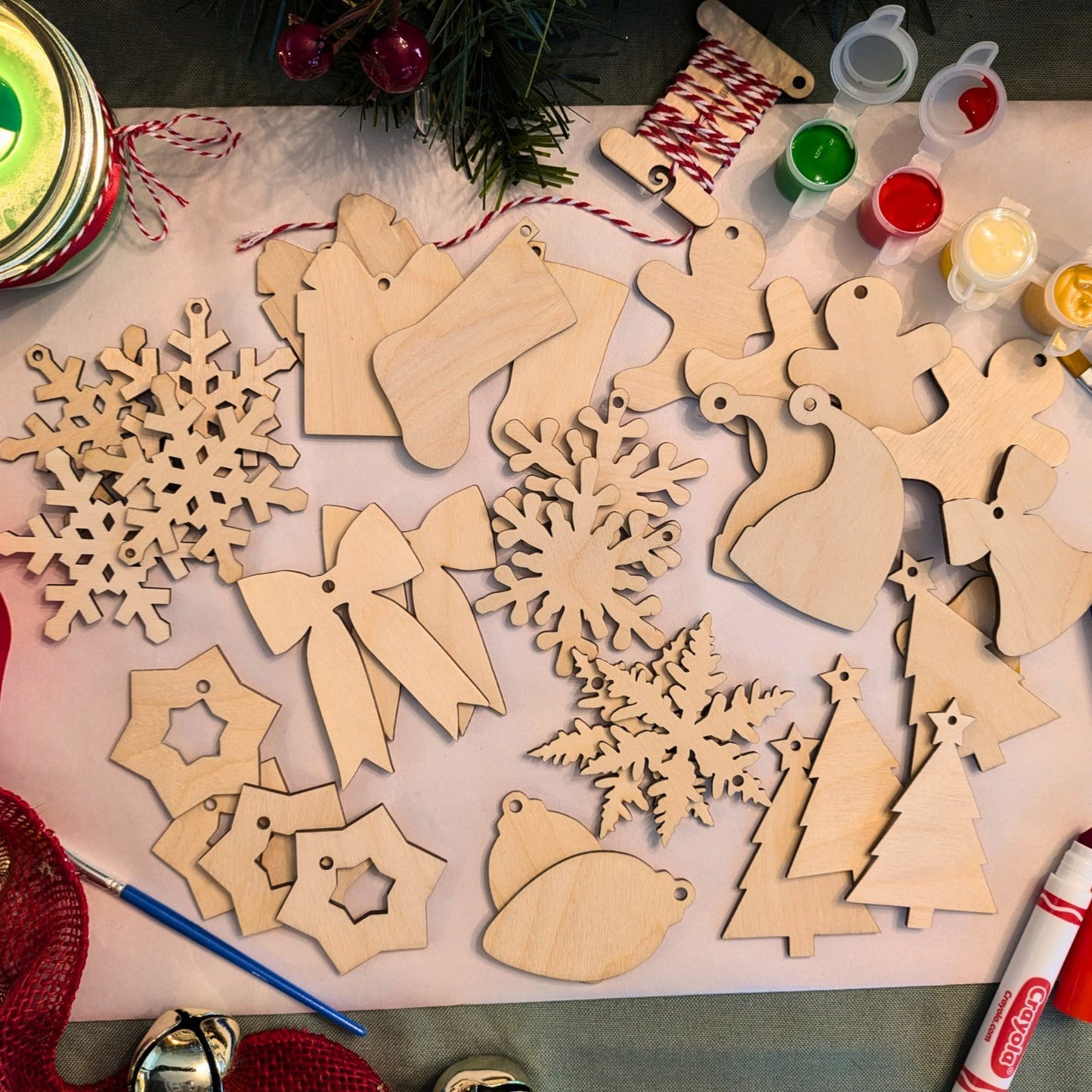 Both sets of Christmas ornament blanks. The ornaments include snowflakes, Christmas stockings, presents, gingerbread men, Santa hats, bells, Christmas trees, ribbons, stars and bulbs.