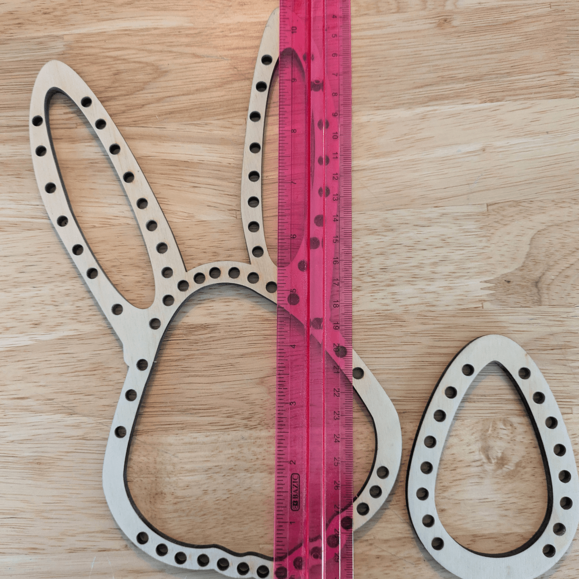 Thea Easter themed rabbit and egg looms next to a ruler for scale. Easter Bunny and Egg Loom Kit Art & Craft Kits Raven King Crafts