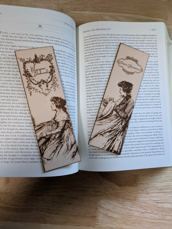 Leather bookmarks engraved with the art of Elinor and Marianne Dashwood engraved on them.