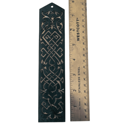 The blue leather cutout bookmark next to a ruler to show scale. Blue Cutout Leather Bookmark with Tassel Hole Bookmarks Raven King Crafts Elvish Style Leather Bookmarks - Pick your color and your tassel Bookmarks Raven King Crafts